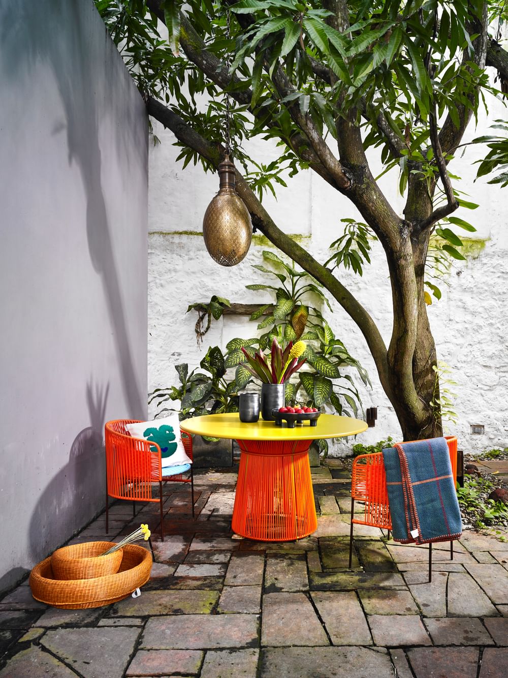 Ames furniture design caribe dining table orange insitu haute living