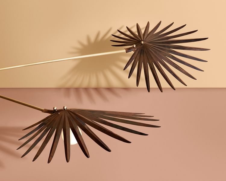 Inspired by the forests of Yucatán, the Inez Chandelier by Rosie Li recalls the natural architecture and structural folds of the fan palm. Hand-pleated copper shades with rich patinas are balanced by carved alabaster counterweights.